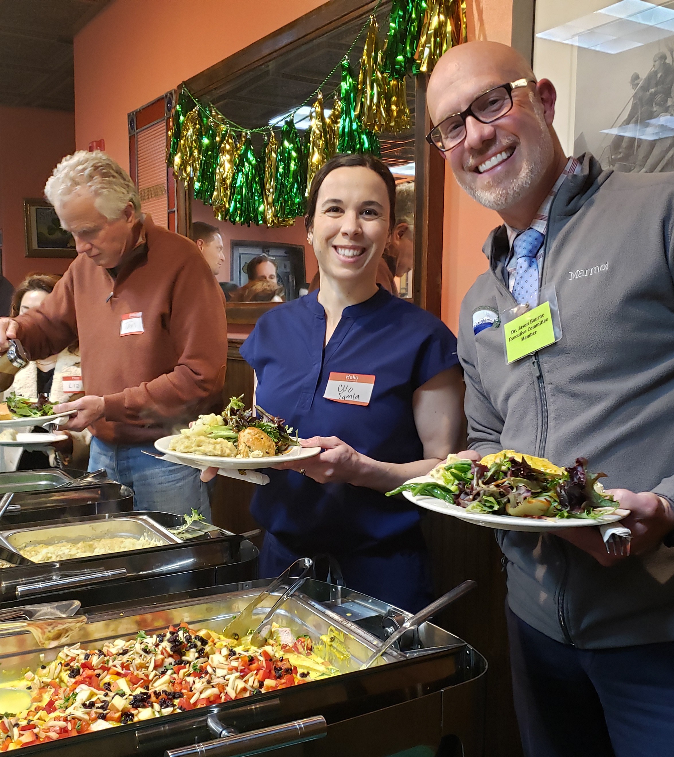 members eating at meeting